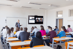 Teacher in medium sized classroom using Conference